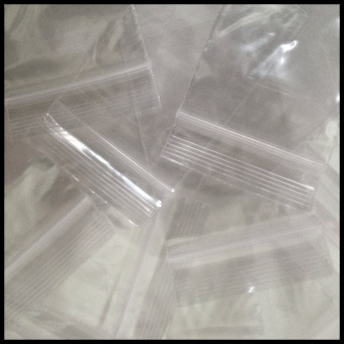 Clear 2x3 inch resealable plastic bags by Original Apple Bags, 4 mil thick, durable reclosable storage solution.