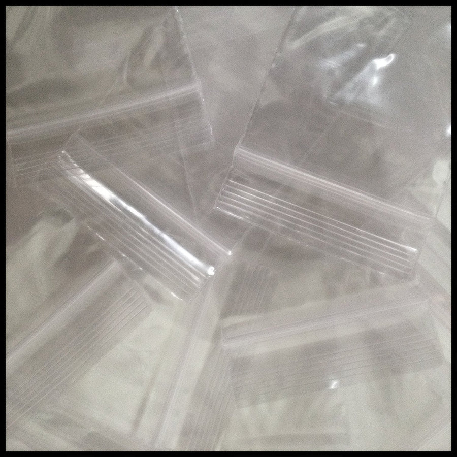 Clear 2x3 inch resealable plastic bags by Original Apple Bags, 4 mil thick, durable reclosable storage solution.